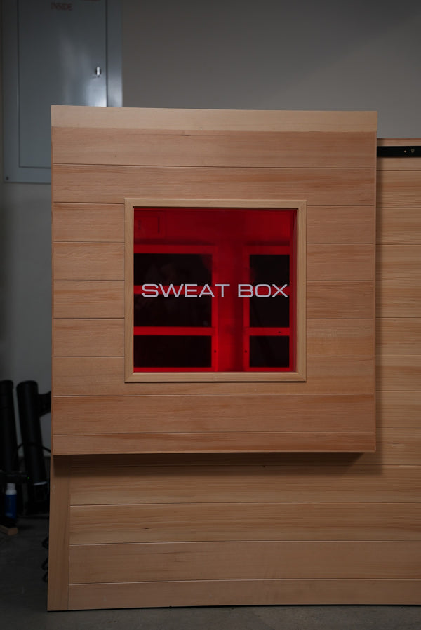 Sliding door open showing the etched Sweat Box window panel