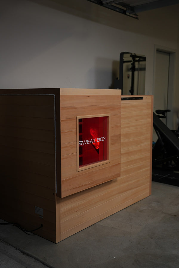 Angled view of the windowed indoor sauna cabin