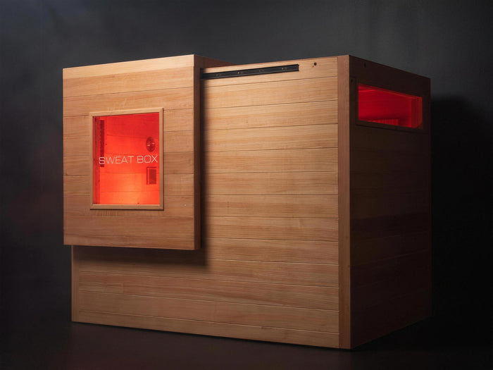Window Edition sauna studio hero with both windows glowing ember red